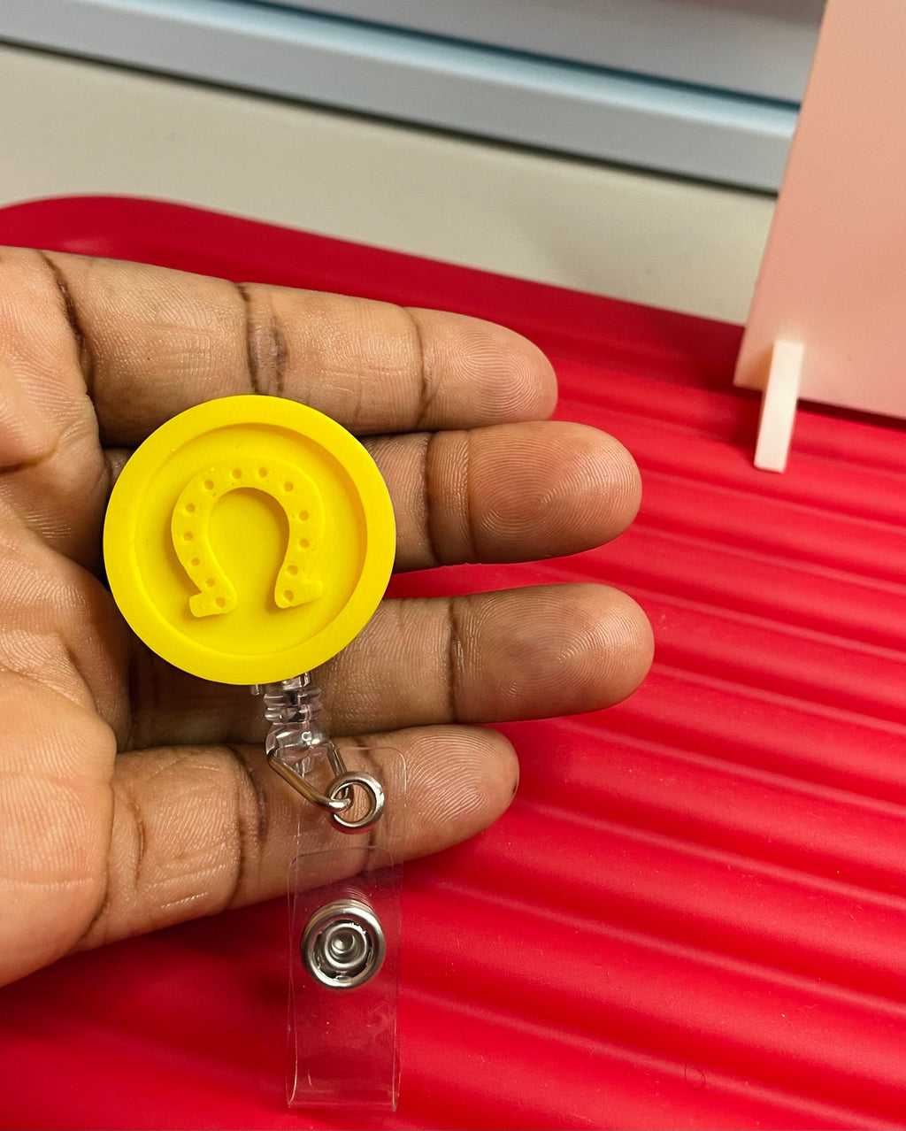 Horseshoe coin reel badge holder